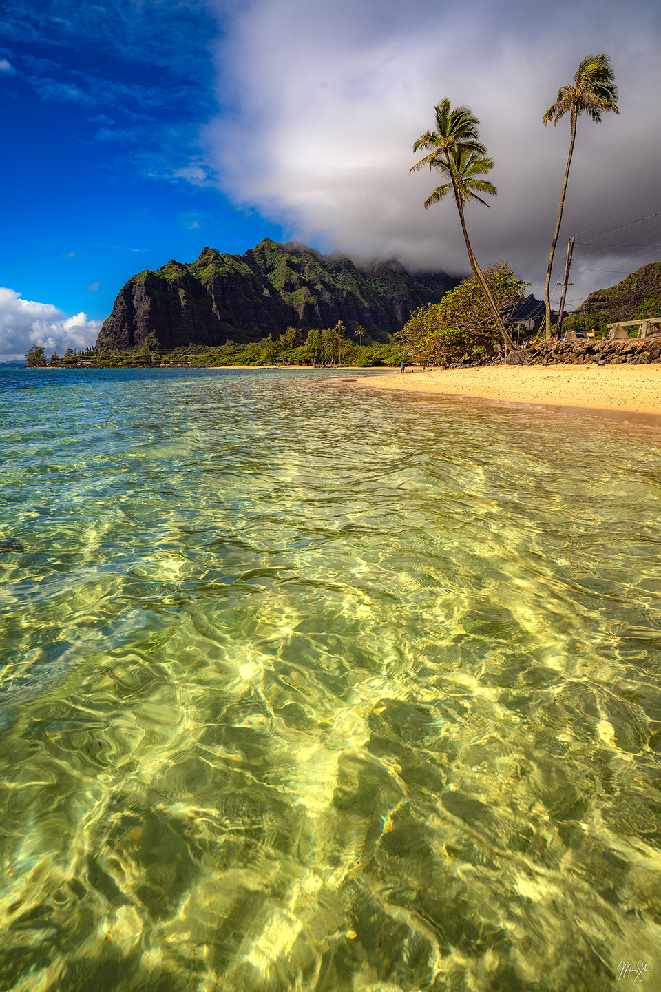 Having waded out into the water during low tide, the calm water of this windward side of Oahu at Kaaawa Beach created a relaxing scene at the beach. The famous mountains of Kualoa Ranch where famous movies and TV shows such as Jurassic Park and Jurassic World were filmed can be seen in the background. Also available in traditional landscape format.