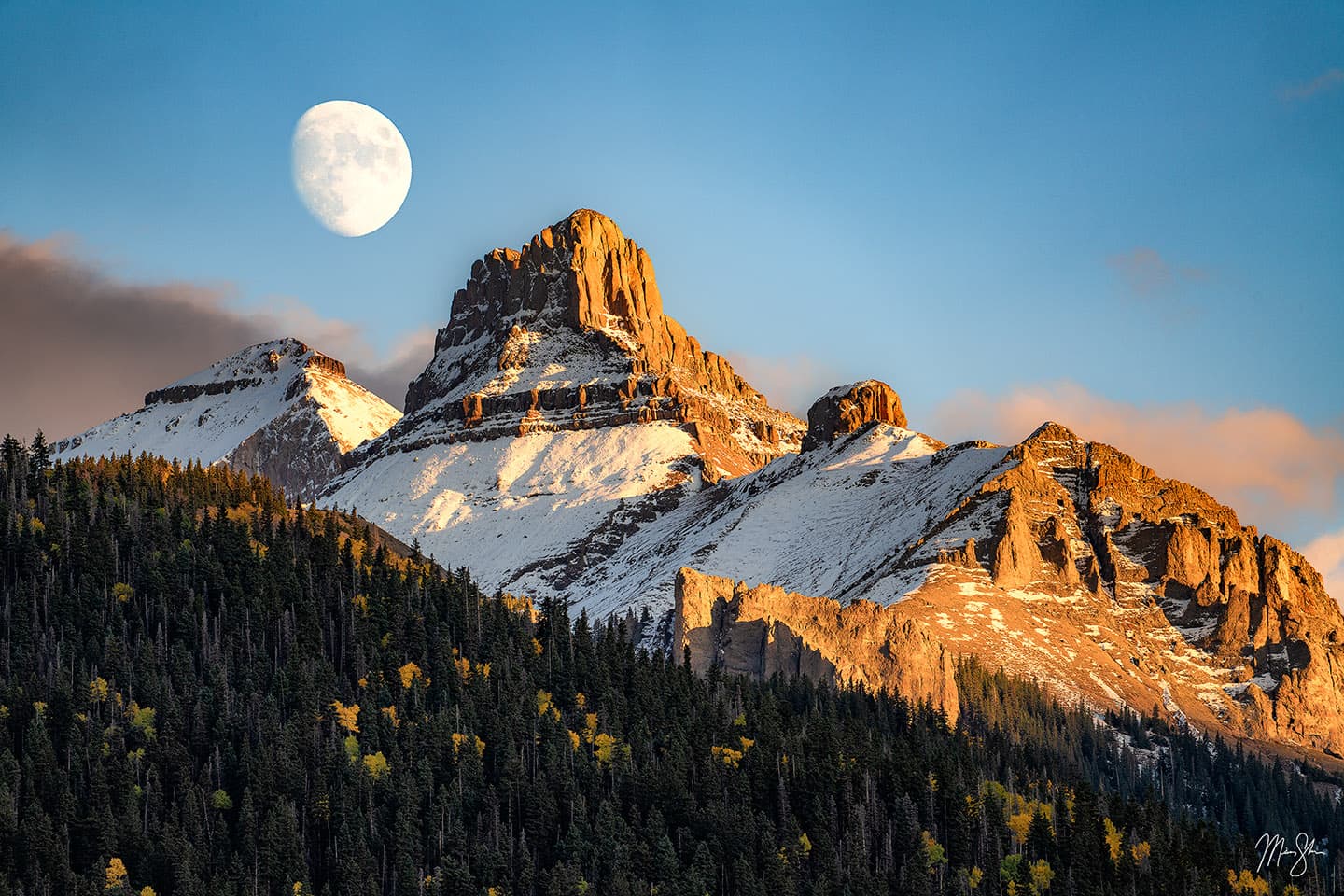 A nearly full moon rises above the jagged peaks just east of Mt Sneffels near Ridgway, Colorado.