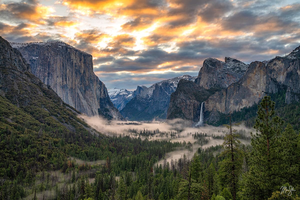 Featured: Sunrise at Tunnel View | Fine art print of a vivid sunset in Yosemite National Park featuring El Capitan, Bridalveil Fall, Half Dome and Cathedral Rocks after a late season snow storm cleared out.